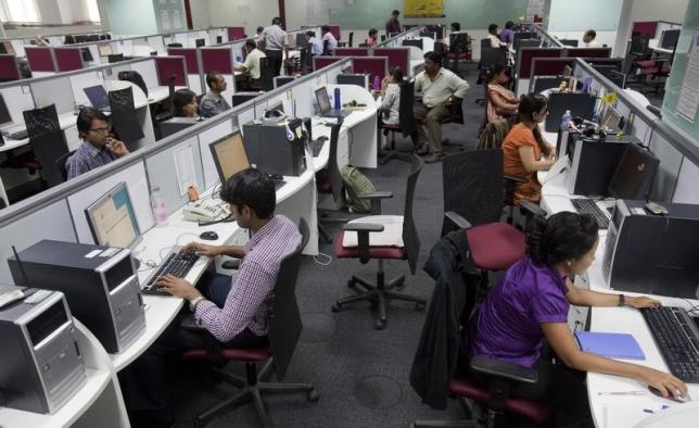 Workers are seen at their workstations on the floor of an outsourcing centre in Bangalore, February 29, 2012. REUTERS/Vivek Prakash/Files